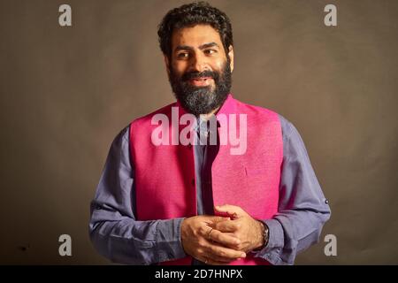 A young Indian man with a typical 'artist' and 'intellectual' look. Stock Photo