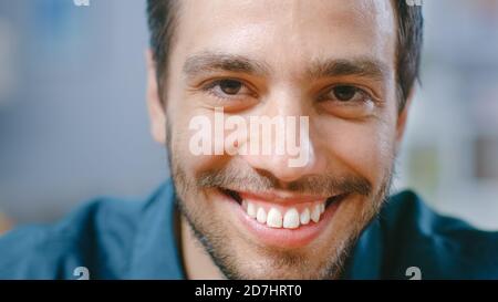 Close-up Portrait of Handsome Hispanic Young Man Smiling on Camera. Stock Photo