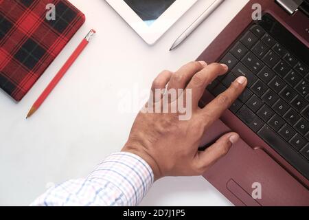 Close up of man hand typing on laptop. Stock Photo