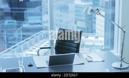 High Angle Shot of a Working Desk of an Successful Person in Office with Cityscape Window View. Stock Photo
