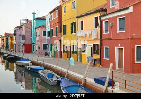 Picturesque Burano is known for its brightly colored fishermen's houses and its casual eateries serving seafood. Stock Photo