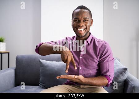 African American Deaf Man Using Sign Language Stock Photo