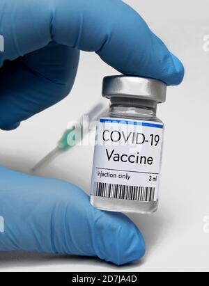 Vaccine against coronavirus in phial at third trial phase at medical laboratory. COVID-19 vaccine at Pfizer. Healthcare and medical concept. Stock Photo