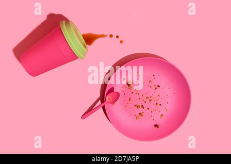 Pink coffee cup and dish against pink background Stock Photo