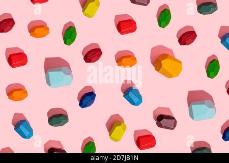 Colorful wooden block against pink background Stock Photo