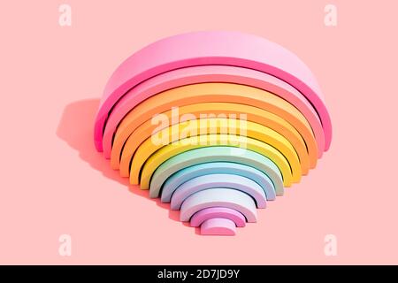Close-up of colorful rainbow toy on pink background Stock Photo