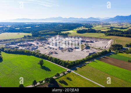 Germany, Bavaria, Huglfing, Drone view of gravel quarry in Alpine foothills during spring