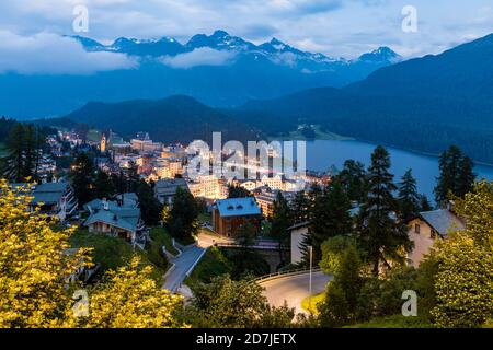 Switzerland, Canton of Grisons, Saint Moritz, Resort town in Engadine valley at dusk Stock Photo