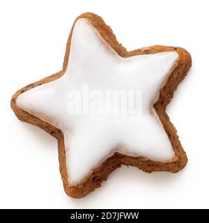 Star shaped gingerbread lebkuchen with white icing isolated on white. Top view. Stock Photo