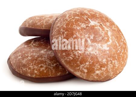 Three glazed gingerbread lebkuchens with chocolate isolated on white. Stock Photo