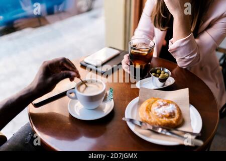 Boyfriend and girlfriend having drinks in cafe Stock Photo