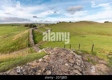 UK, England, Hexham, Hadrians Wall surrounded by green countryside hills Stock Photo