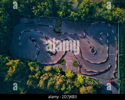 Aerial view of go-cart track amidst trees Stock Photo