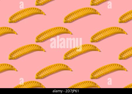 Banana slicer on pink background Stock Photo