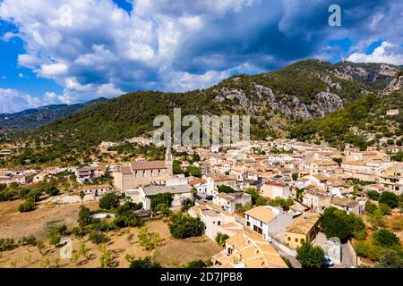 Houses in residential district near mountains against cloudy sky, Caimari, Majorca, Spain Stock Photo