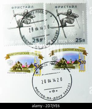 MOSCOW, RUSSIA - MARCH 11, 2020: Postage stamp printed in Russia with stamp of Rostov-on-Don shows Freestyle skiing, Winter Olympic Games 2014 - Sochi Stock Photo