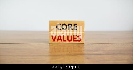 Concept text 'core values' on wooden blocks on a beautiful wooden table, white background. Business concept, copy space. Stock Photo