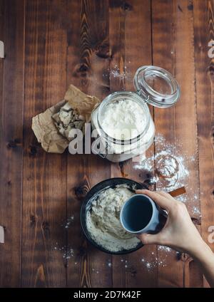 Preparation of sourdough for bakery. Bakery concept. Copy space. Stock Photo