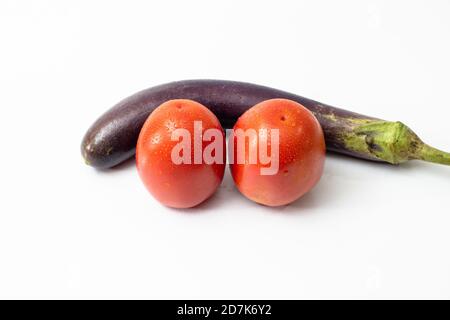 Eggplant and tomatos with water drop on white background Stock Photo