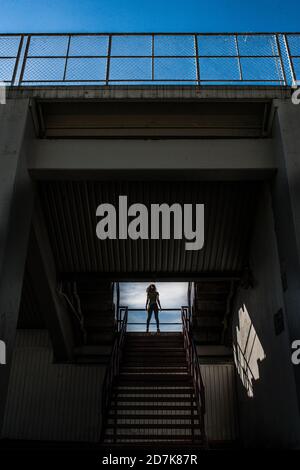 Fit Woman Doing workout at a Stadium Stock Photo