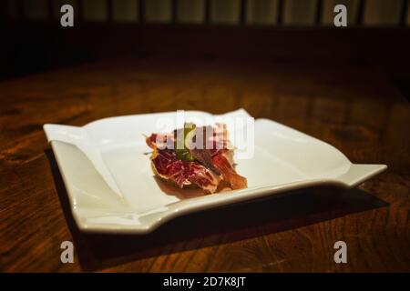 Bar food skewer with serrano ham Stock Photo