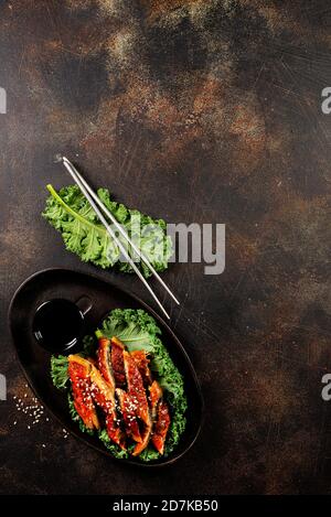 Japanese eel grilled or Unagi ibaraki set on plate, eel with sesame and unagi sauce Stock Photo