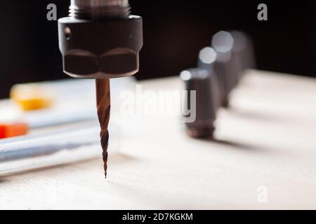 spindle with a cnc router mill over a wooden surface Stock Photo