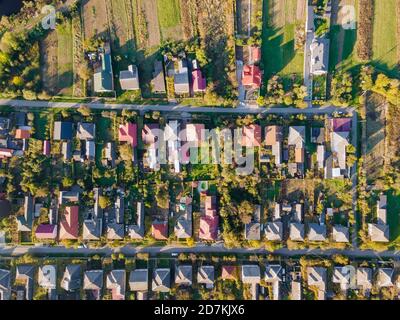 Beautiful small village house in a small village in top aerial view green village from above with fields Stock Photo