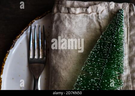Minimalistic table setting for Christmas dinner on wooden table Stock Photo
