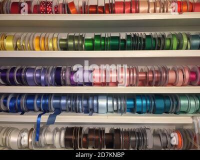 haberdashery haberdasher ribbon reels rolls rows and trims in fabric retail shop  sew sewing supplies for sale retail shop market stock, photo Stock Photo