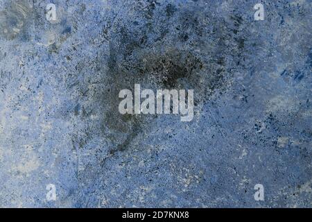 abstract Concrete dark blue black background with scuffs and splashes. Textured hand made wall texture in grunge style with soft focus. Space for text Stock Photo