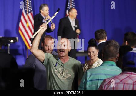 Raleigh, North Carolina, USA. 23rd Oct, 2020. MICHAEL MARSHALL of Lexington, KY yells about Evangelical pastor, JENTEZEN FRANKLIN as he is escorted from the Evangelicals for Trump: Praise, Prayer and Patriotism program with Eric Trump at the RFA Church. Marshall was escorted out of the church without incident. Credit: Bob Karp/ZUMA Wire/Alamy Live News Stock Photo