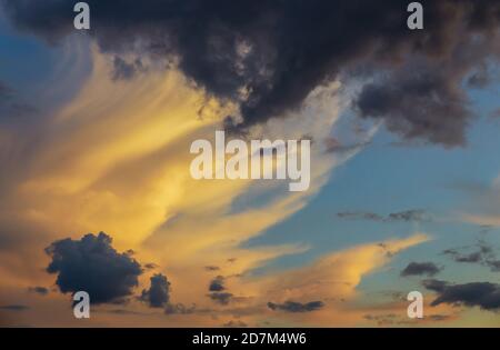 Colorful biautiful sunset sky with few clouds for wallpaper. Stock Photo