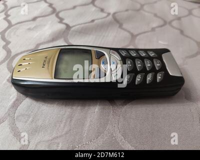 Nokia old Mobile Phone in black and gold colors, Nokia's most popular phone launched in the 2000's Stock Photo