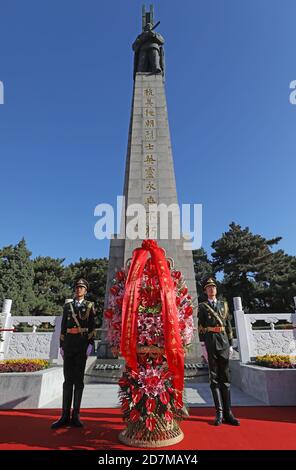 (201024) -- BEIJING, Oct. 24, 2020 (Xinhua) -- A ceremony presenting flower baskets as a tribute to martyrs of the Chinese People's Volunteers (CPV) in the War to Resist U.S. Aggression and Aid Korea is held at the CPV martyrs' cemetery in Shenyang, northeast China's Liaoning Province, on Oct. 23, 2020. Flower baskets have been laid at four memorial sites in both China and the Democratic People's Republic of Korea (DPRK) as a tribute to martyrs of the CPV in the War to Resist U.S. Aggression and Aid Korea. The flower baskets were sent in the name of Chinese President Xi Jinping, also genera Stock Photo