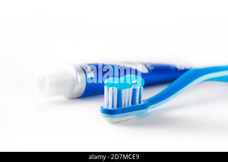 Blue tooth brush in glass. Isolated on white background Stock Photo