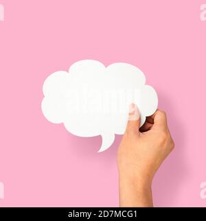 Hand holding an empty speech bubble Stock Photo