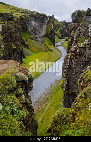 Fjaðrárgljúfur is a magnificent and massive canyon, about 100 meters deep and about two kilometres long. Stock Photo
