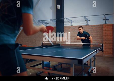 Two men play table tennis, ping pong players Stock Photo