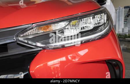 Phayao, Thailand - Sep 13, 2020: Headlight of Red Toyota Yaris Ativ 2020 in Toyota Car Dealership Showroom Stock Photo