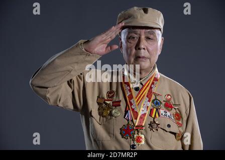 (201024) -- BEIJING, Oct. 24, 2020 (Xinhua) -- Tang Zhanghong, veteran of the Chinese People's Volunteers (CPV), salutes in Chengdu, southwest China's Sichuan Province, Oct. 16, 2020. Tang was born in 1935. He entered the Democratic People's Republic of Korea (DPRK) to fight in the War to Resist U.S. Aggression and Aid Korea with the CPV army in 1951.  On Oct. 19, 1950, as requested by the DPRK, CPV forces crossed the Yalu River to aid the DPRK's fight there until a truce was signed in 1953. A total of 2.9 million CPV soldiers entered the battlefield.   Photographers from Xinhua took portrait Stock Photo