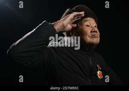 (201024) -- BEIJING, Oct. 24, 2020 (Xinhua) -- Huang Zhongmao, veteran of the Chinese People's Volunteers (CPV), salutes in Enshi Tujia and Miao Autonomous Prefecture, central China's Hubei Province, Oct. 6, 2020. Huang was born in 1929. He entered the Democratic People's Republic of Korea (DPRK) to fight in the War to Resist U.S. Aggression and Aid Korea with the CPV army in 1950.  On Oct. 19, 1950, as requested by the DPRK, CPV forces crossed the Yalu River to aid the DPRK's fight there until a truce was signed in 1953. A total of 2.9 million CPV soldiers entered the battlefield.   Photograp Stock Photo