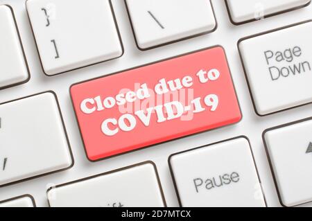 Closed due to COVID-19 key on keyboard Stock Photo