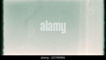 Noisy film frame with heavy scratches, dust and grain. Abstract old film background Stock Photo