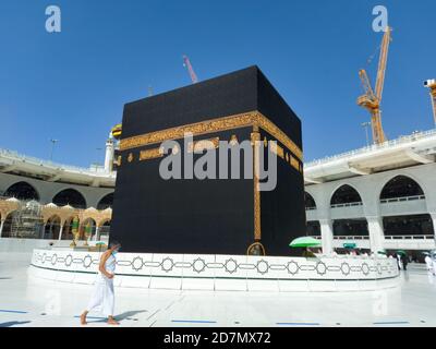 MECCA, SAUDI ARABIA , OCTOBER 22, 2020 - The Holy Kaaba - Pilgrims return to Mecca for limited umrah as  coronavirus restrictions - face mask wearing Stock Photo