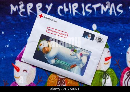 Post on Christmas mat - charity appeal, Christmas appeal from British Red Cross - Merry Christmas Stock Photo
