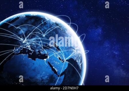 Connections around planet Earth viewed from space at night, cities connected around the globe by shiny lines, international travel or global business Stock Photo