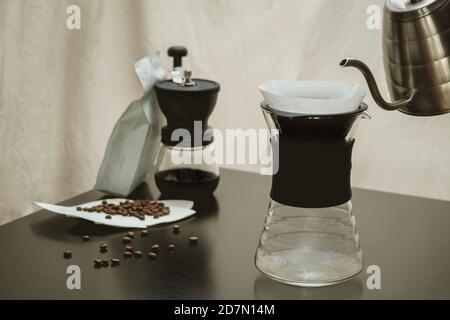 Alternative method of making coffee, funnel drip glasses with paper filter  and aeropress Stock Photo - Alamy