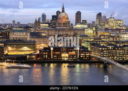 The dome of St Paul's Cathedral in the City of London, from across the River Thames, with projection of William Blake’s ‘Ancient of Days’, London, UK Stock Photo