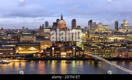 The dome of St Paul's Cathedral in the City of London, from across the River Thames, with projection of William Blake’s ‘Ancient of Days’, London, UK Stock Photo